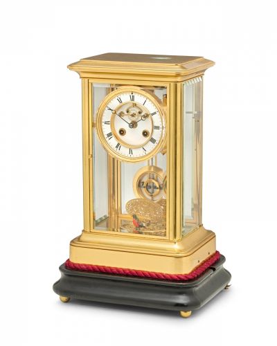 An unusual French gilt brass mantel regulator with singing bird automaton