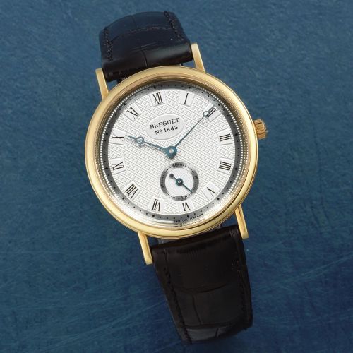 Breguet. An 18K gold manual wind wristwatch