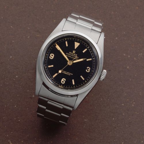 Rolex. A rare stainless steel automatic bracelet watch with gilt honeycomb dial