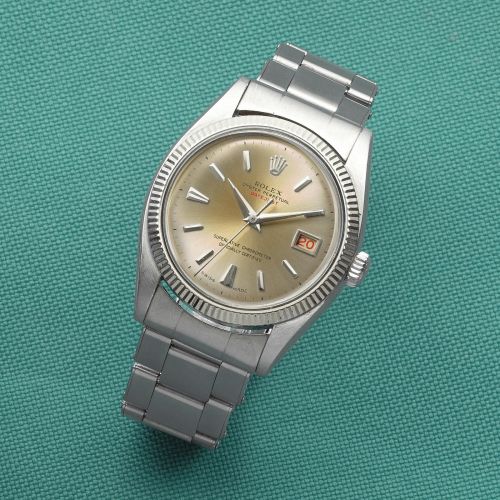 Rolex. A rare and early stainless steel automatic calendar bracelet watch with roulette date wheel and red Datejust