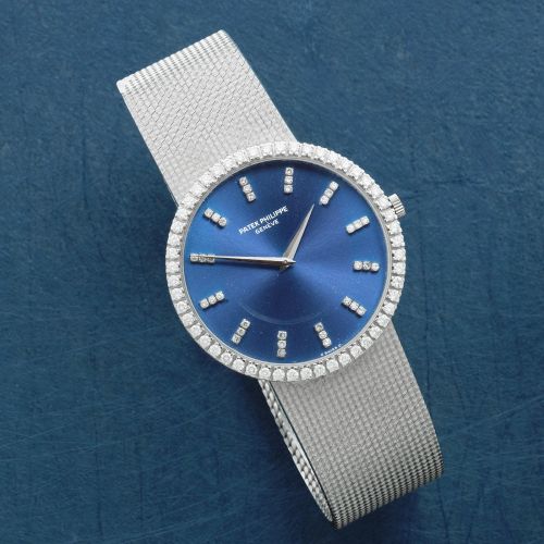 Patek Philippe. An 18K white gold and diamond set automatic bracelet watch