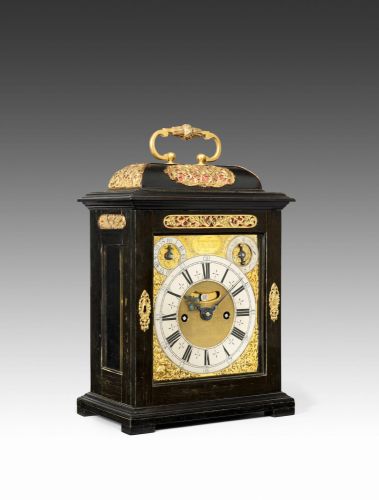 A fine late 17th century ebony veneered quarter repeating table clock