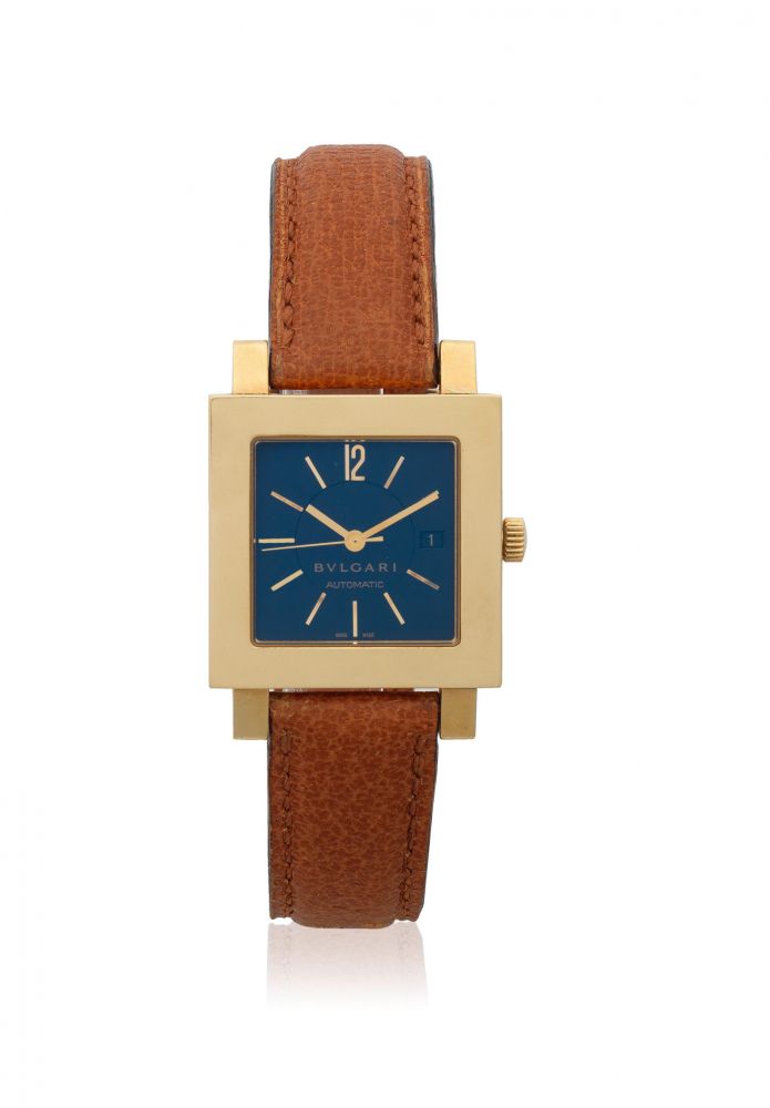 Bulgari. A mid-size 18K gold automatic calendar square wristwatch