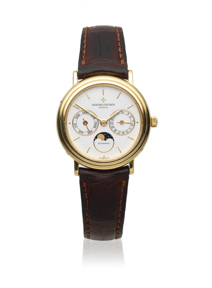 Vacheron Constantin. An 18K gold automatic annual calendar wristwatch with moon phase