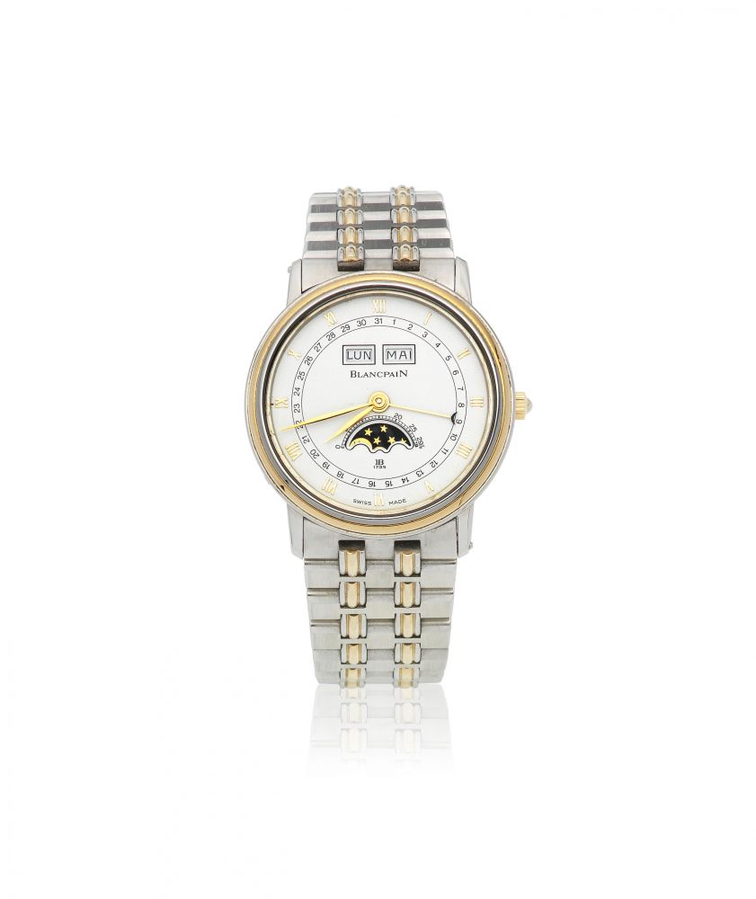 Blancpain. A gold and stainless steel manual wind annual calendar bracelet watch with moon phase