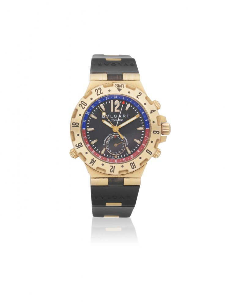 Bulgari. An 18K gold automatic chronograph wristwatch with dual time