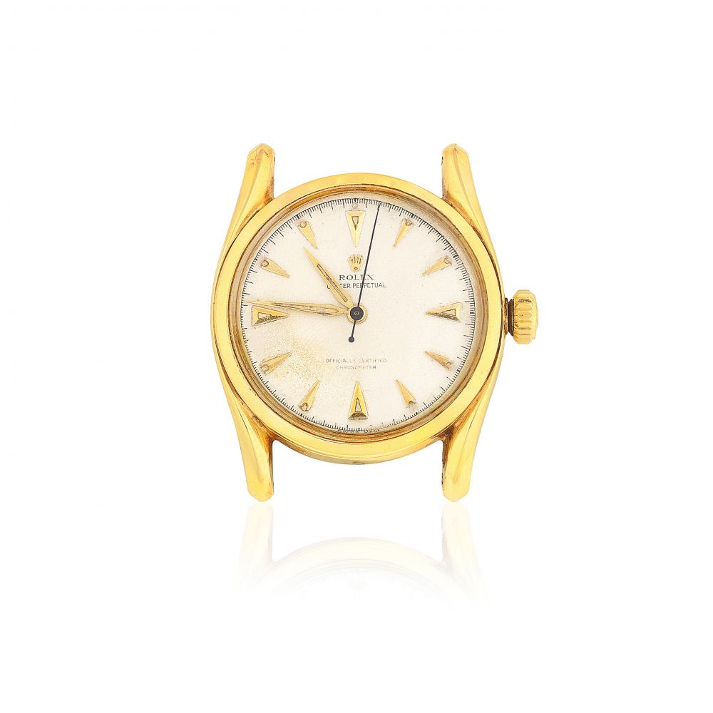 Rolex. A 14K gold automatic watch