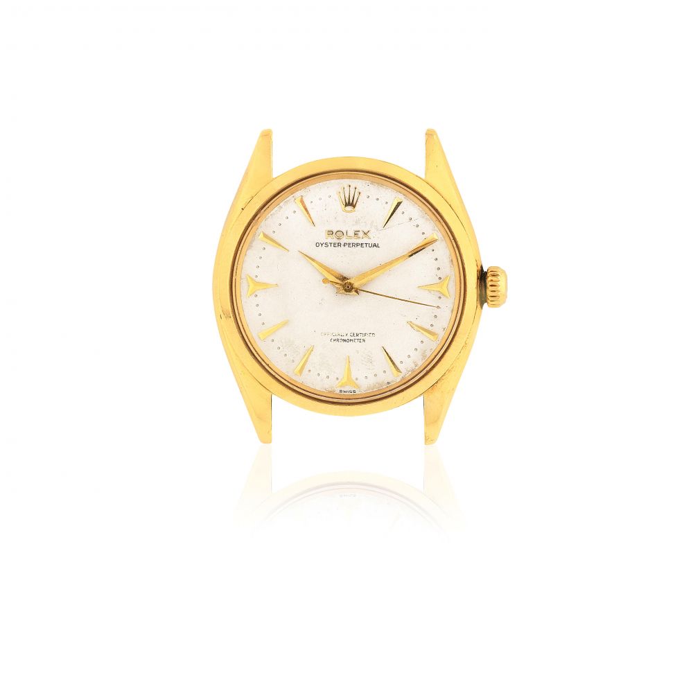 Rolex. An 18K gold automatic wristwatch