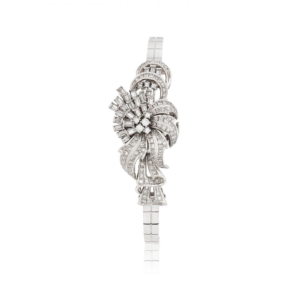 Rolex. A lady's 18K white gold and diamond set manual wind bracelet watch with concealed dial