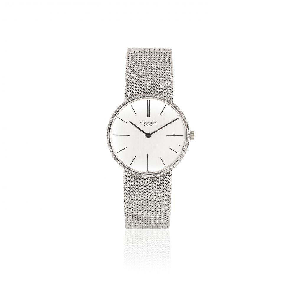 Patek Philippe. An 18K white gold mid-size manual wind bracelet watch