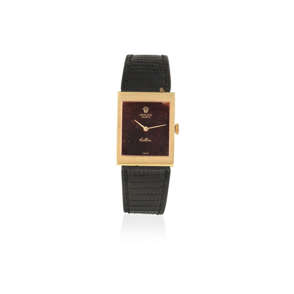 Rolex. A lady's 18K gold manual wind rectangular wristwatch with mirrored dial