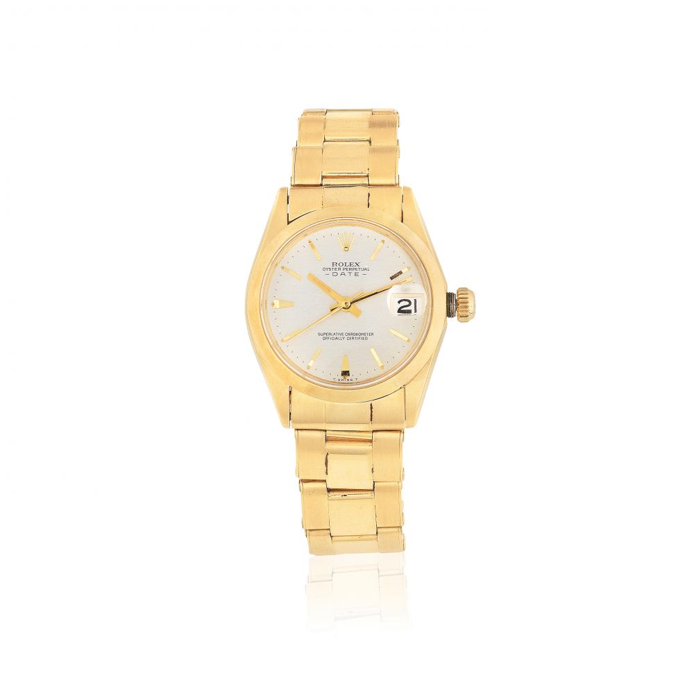 Rolex. A mid-size 18K gold automatic calendar bracelet watch