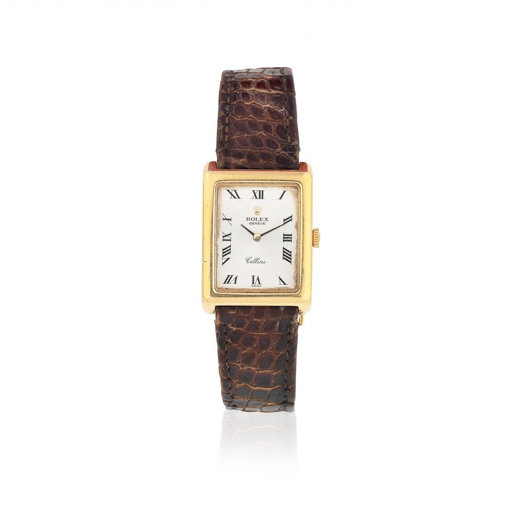 Rolex. A lady's 18K gold manual wind rectangular wristwatch