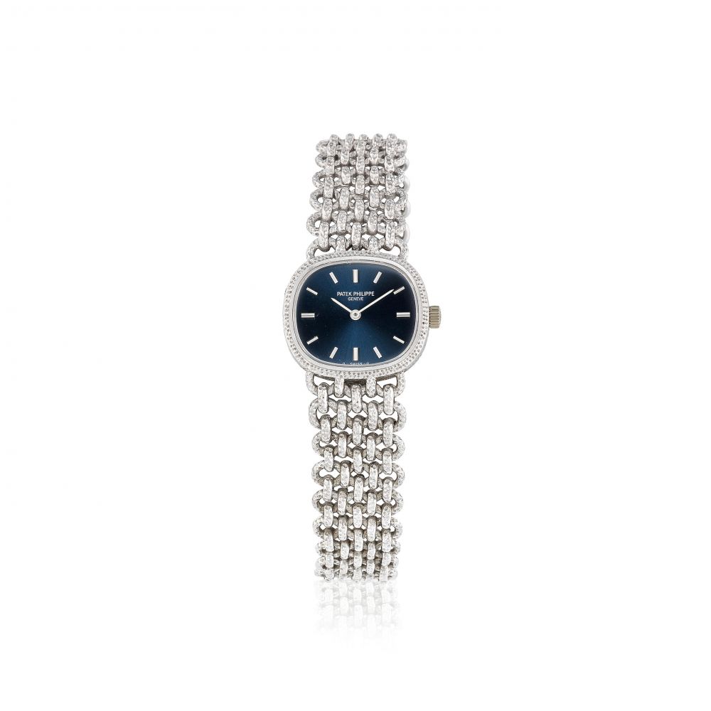 Patek Philippe. A lady's 18K white gold manual wind bracelet watch