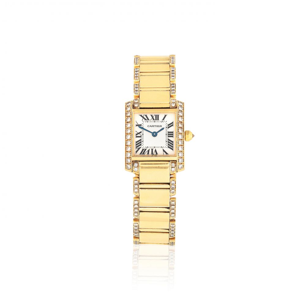 Cartier. A lady's 18K gold and diamond set quartz bracelet watch