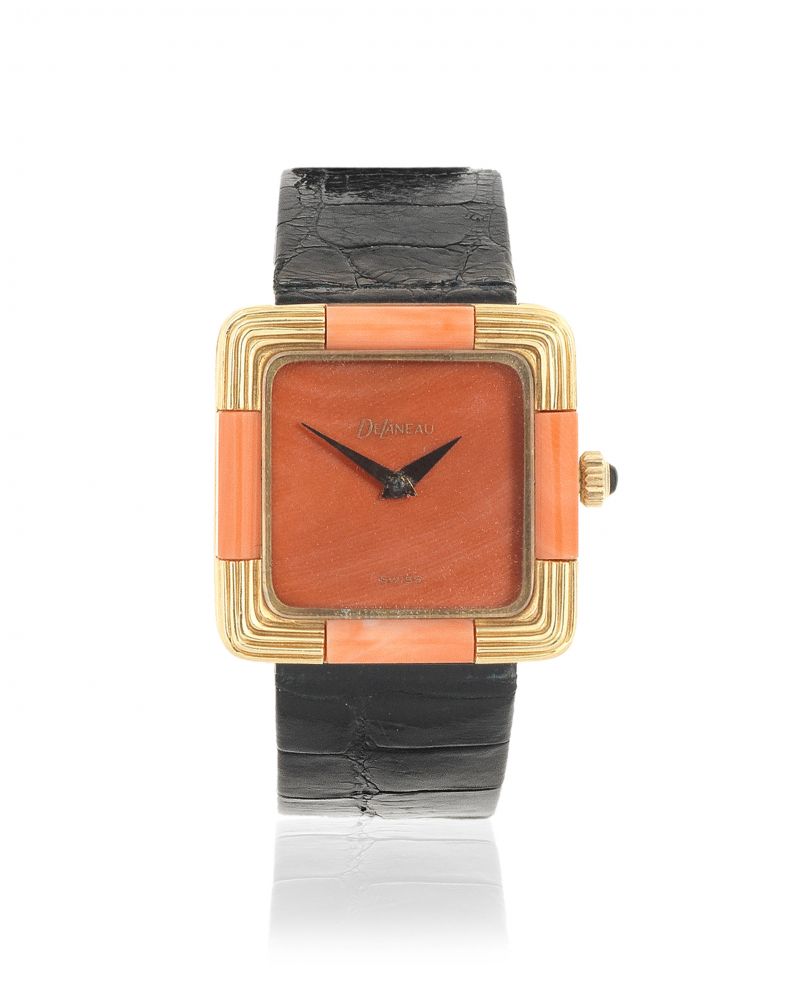 DeLaneau. A lady's 18K gold manual wind cushion form wristwatch with coral dial