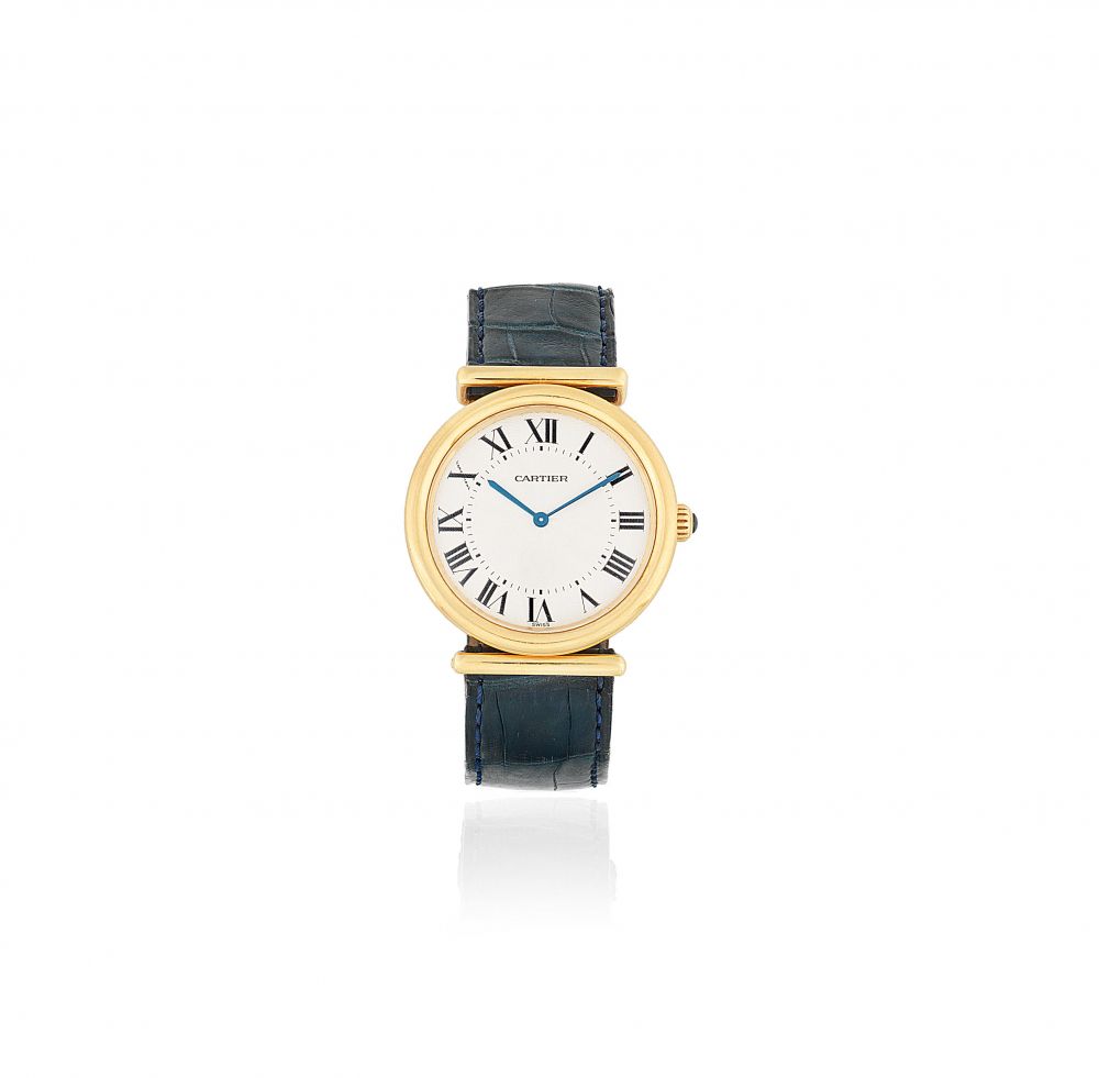 Cartier. An 18K gold manual wind wristwatch