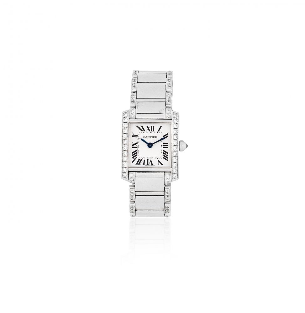 Cartier. A lady's 18K white gold and diamond set quartz bracelet watch