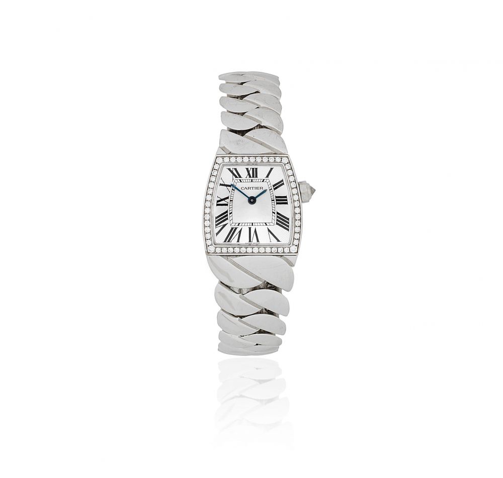 Cartier. A lady's 18K white gold and diamond set quartz bracelet watch