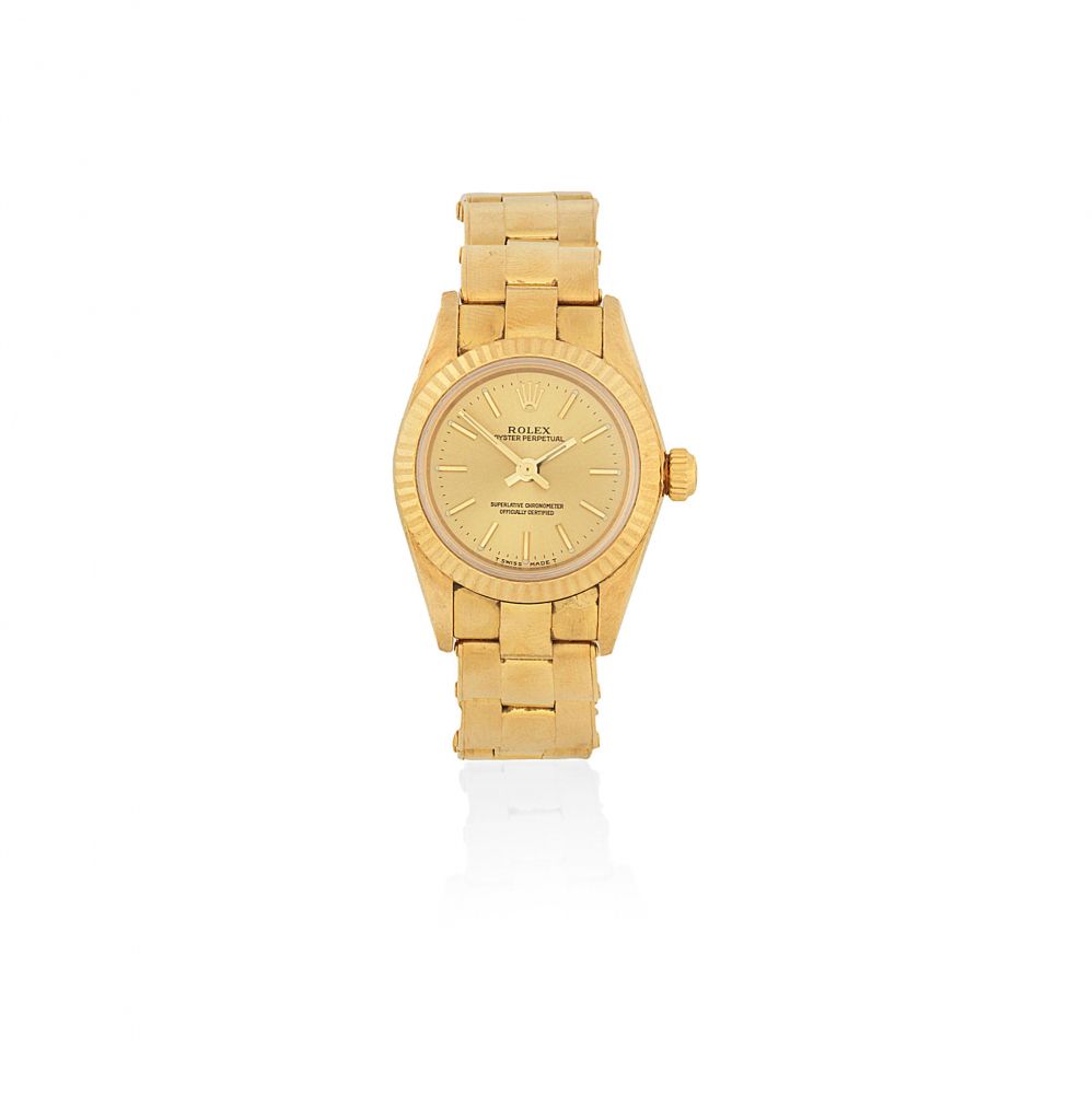 Rolex. A lady's 18K gold automatic bracelet watch