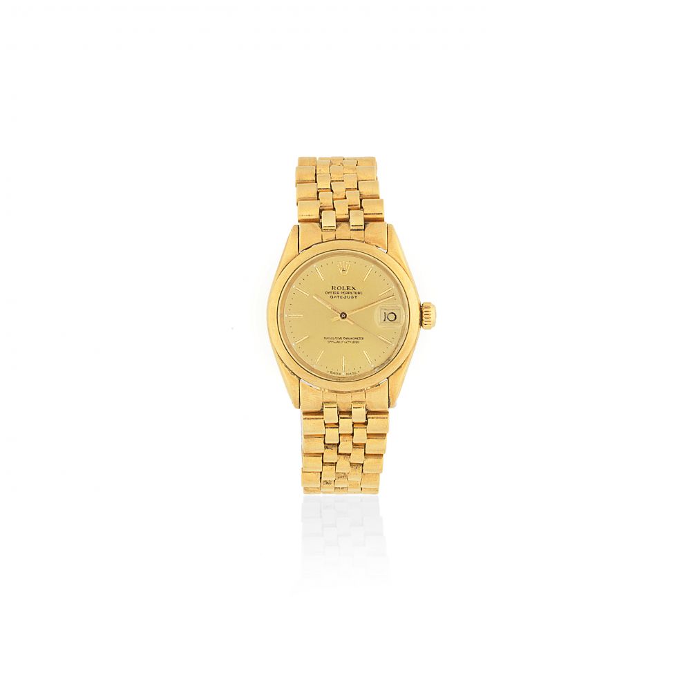 Rolex. A mid-size 18K gold automatic calendar bracelet watch