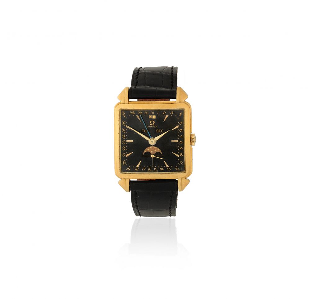 Omega. A rare 18K gold manual wind calendar wristwatch with moon phase