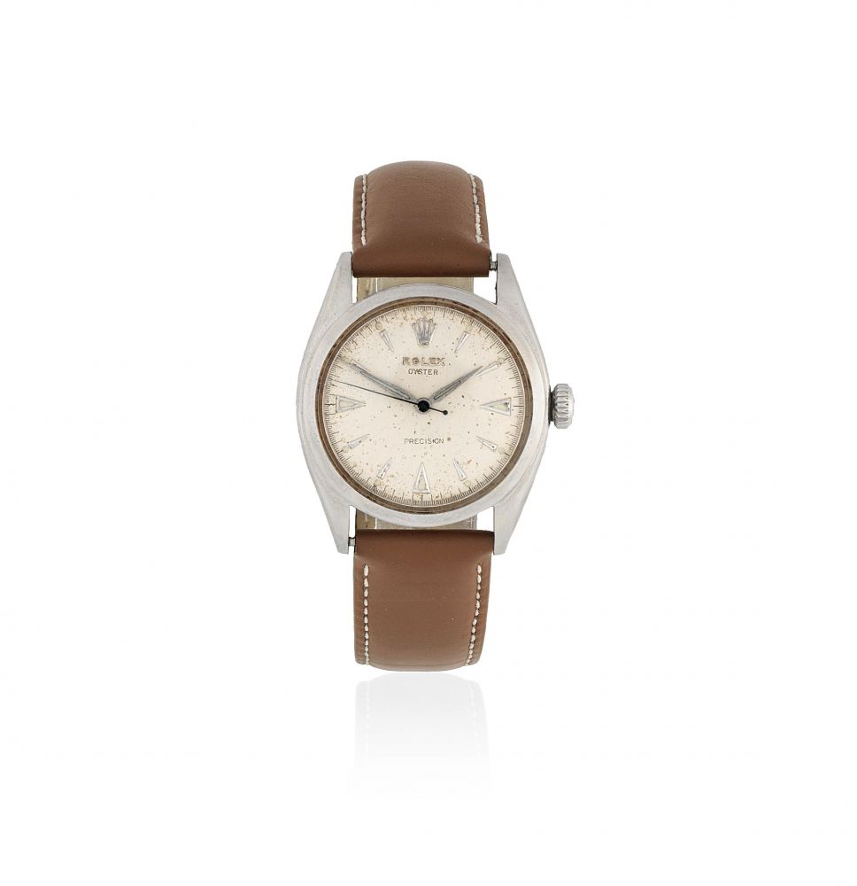 Rolex. A stainless steel manual wind wristwatch