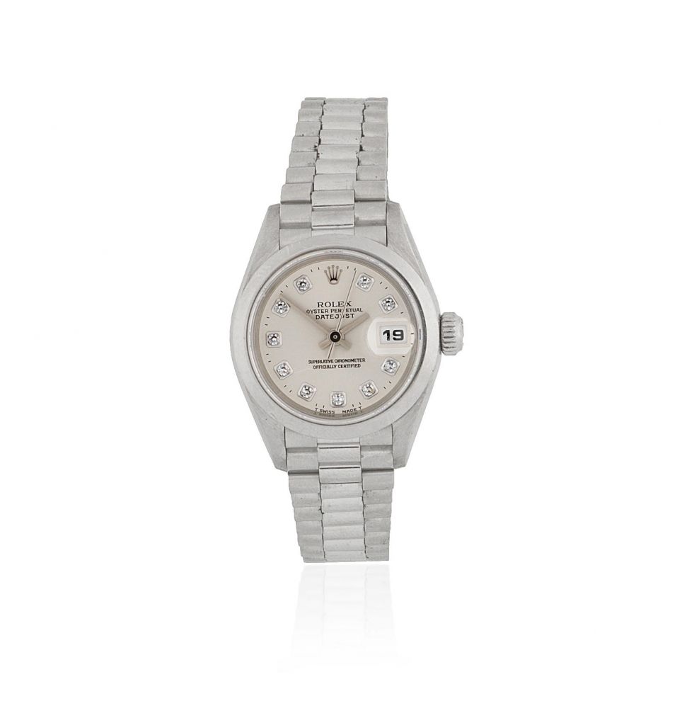Rolex. A lady's platinum and diamond set automatic calendar bracelet watch