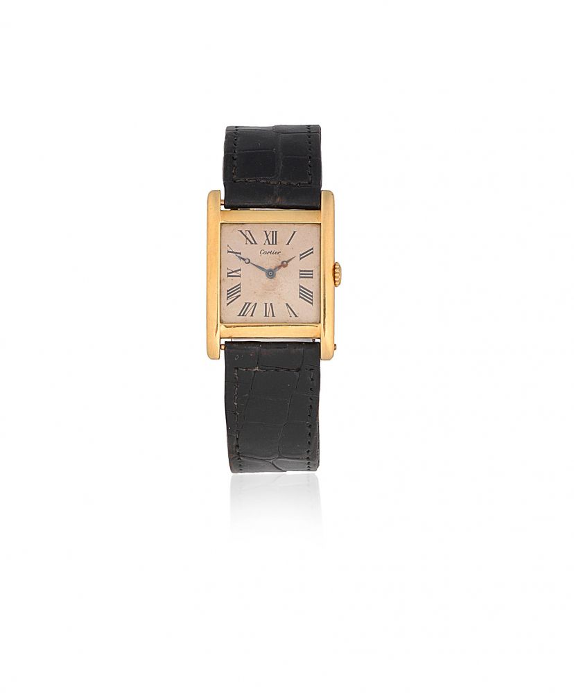 Cartier. An early 18K gold manual wind rectangular wristwatch