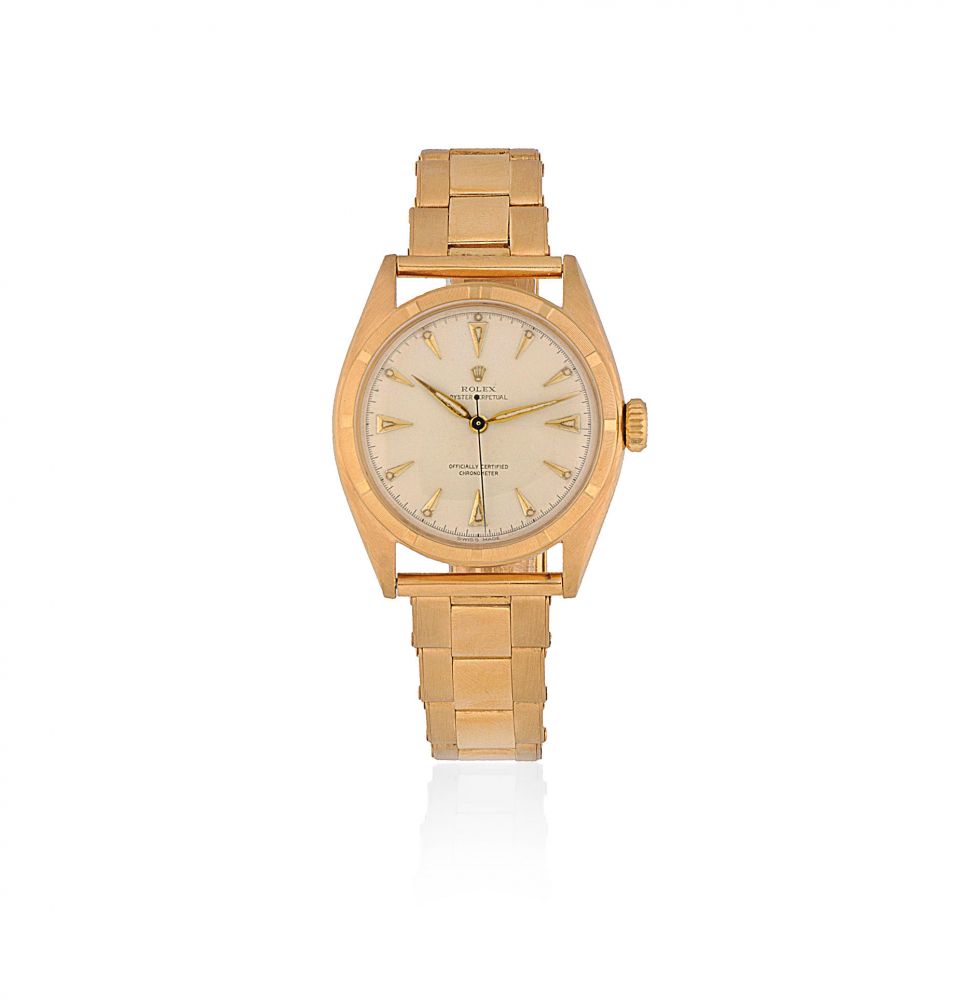 Rolex. An 18K gold automatic bracelet watch