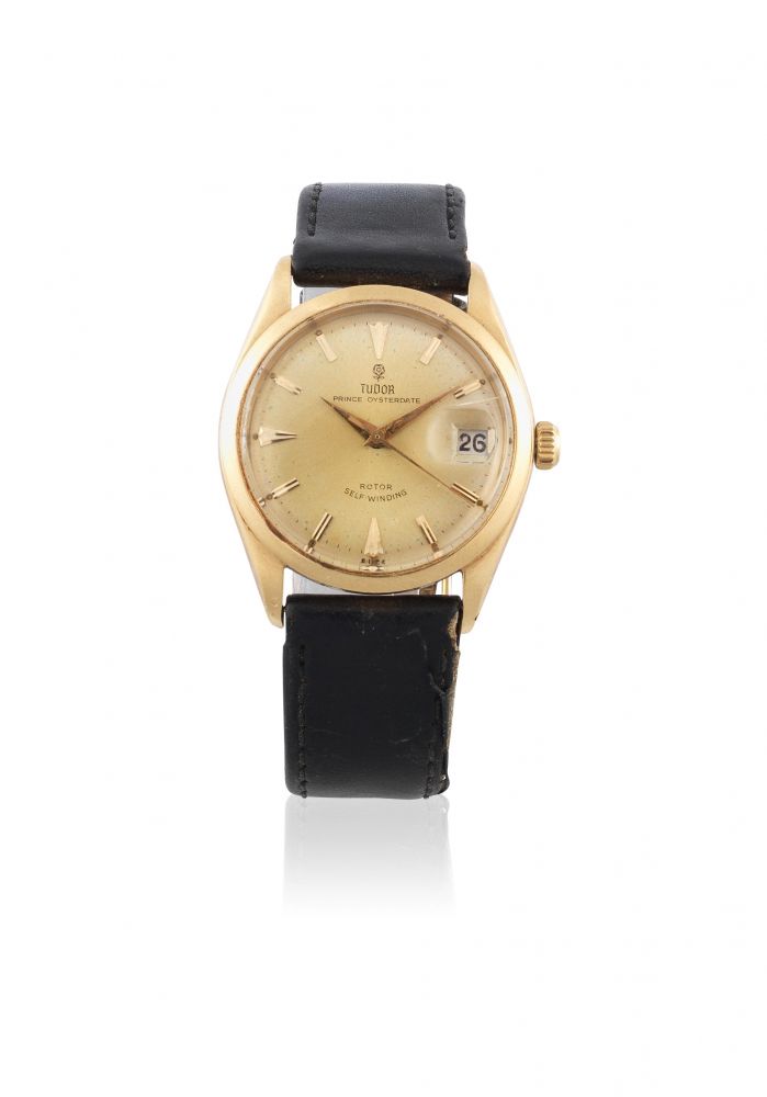 Tudor. An 18K gold automatic calendar wristwatch