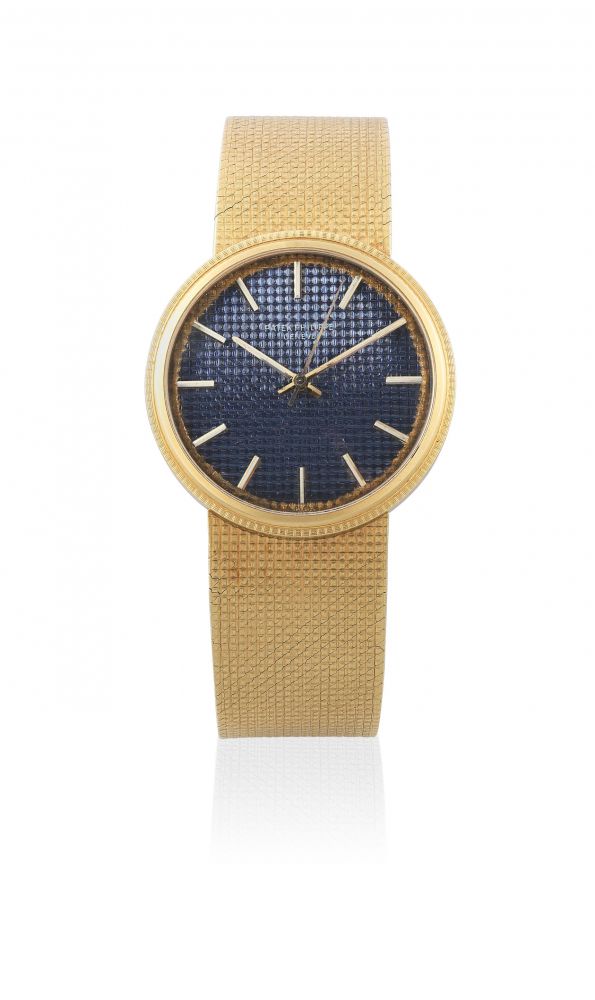 Patek Philippe. An 18K gold automatic bracelet watch