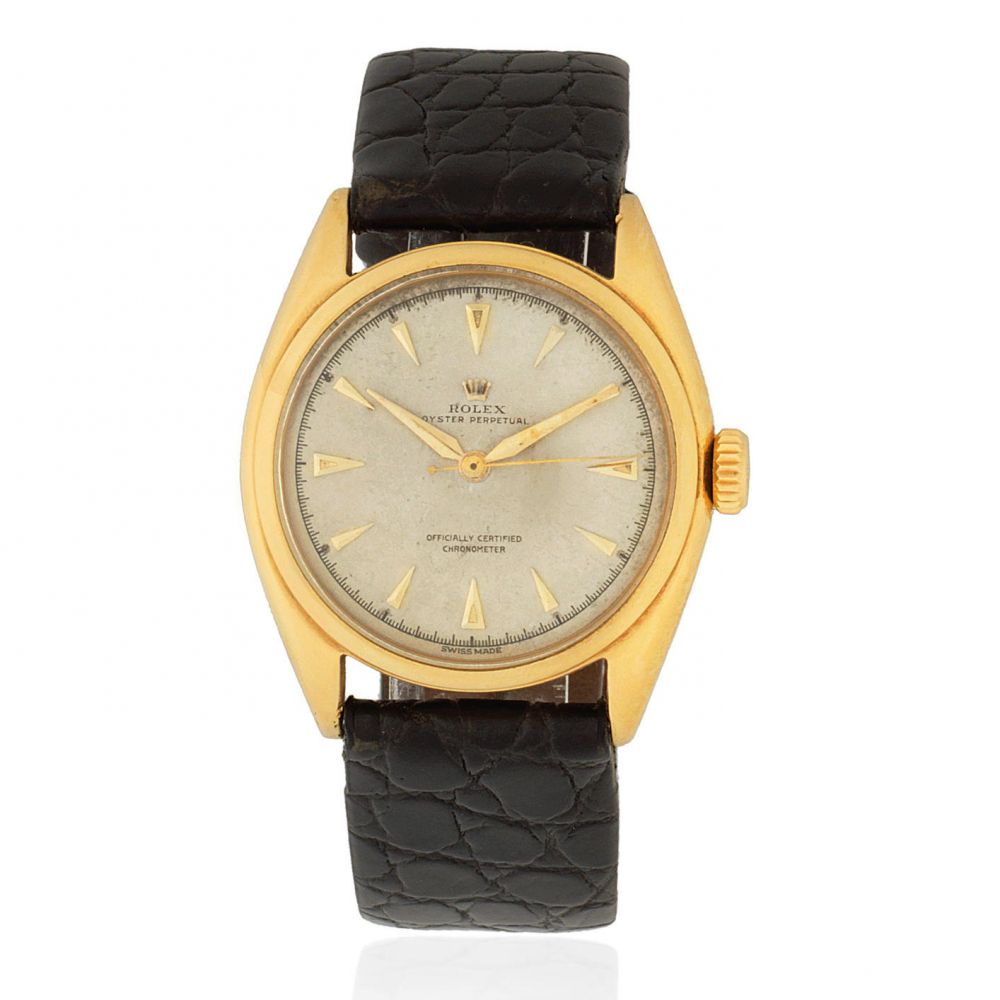 Rolex. An 18K gold automatic wristwatch