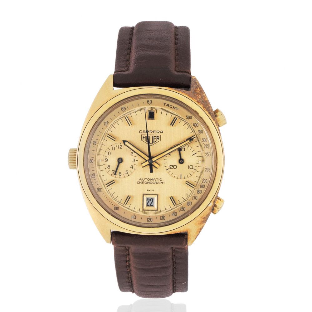 Heuer. An 18K gold automatic calendar chronograph wristwatch