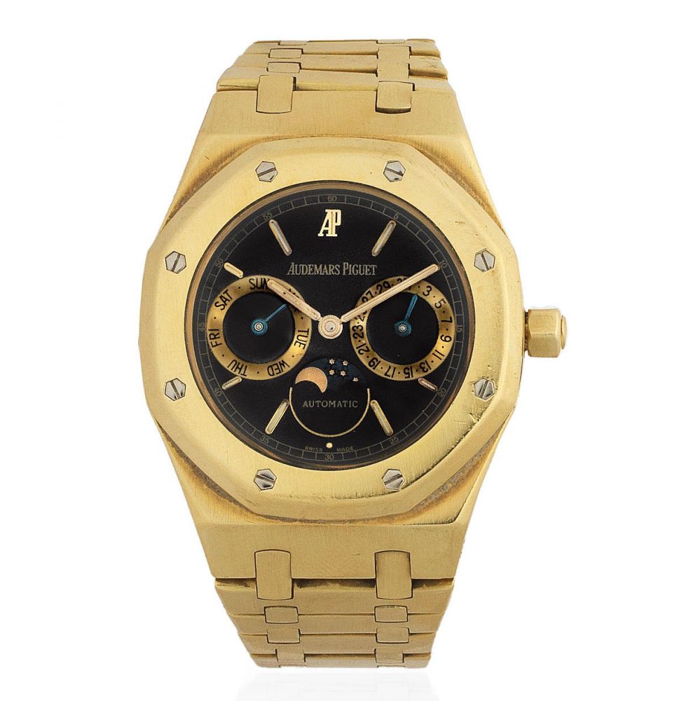 Audemars Piguet. An 18K gold automatic calendar bracelet with moon phase