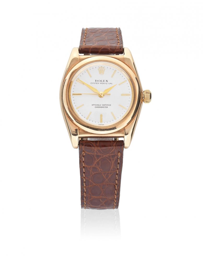 Rolex. A 14K gold automatic bubble back wristwatch