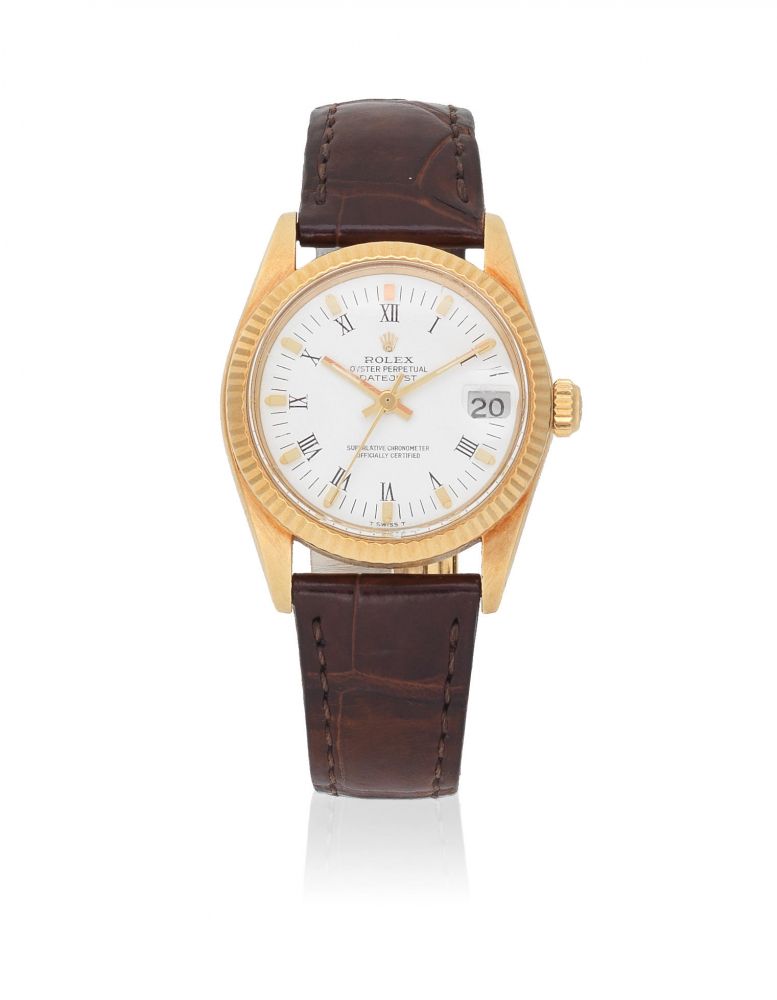 Rolex. An 18k gold automatic calendar wristwatch