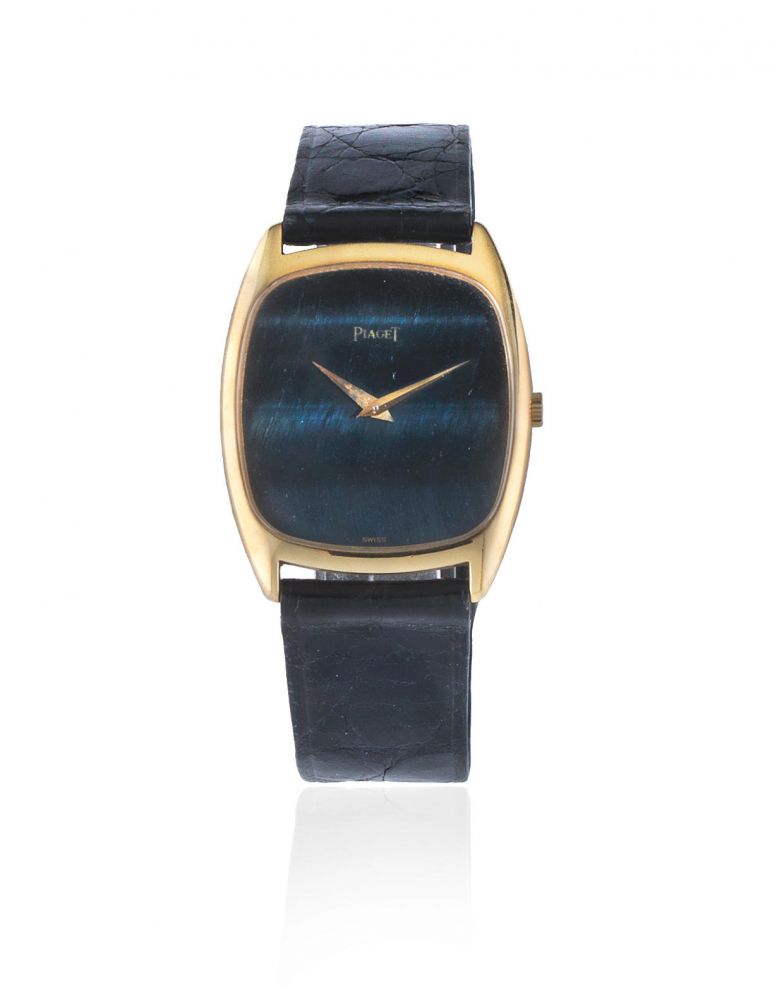 Piaget. An 18K gold manual wind tonneau form wristwatch with hardstone dial