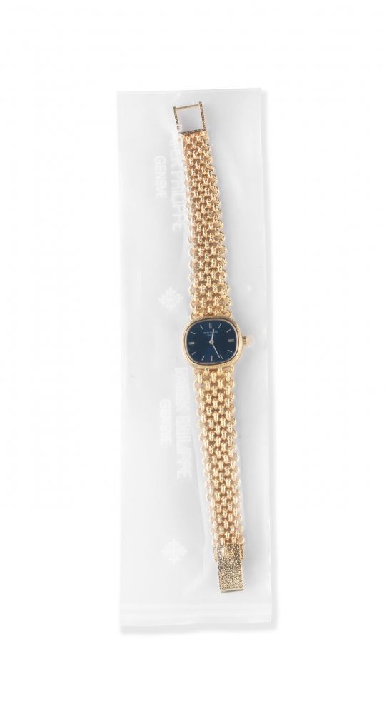 Patek Philippe. A service sealed lady's 18K gold manual wind oval bracelet watch
