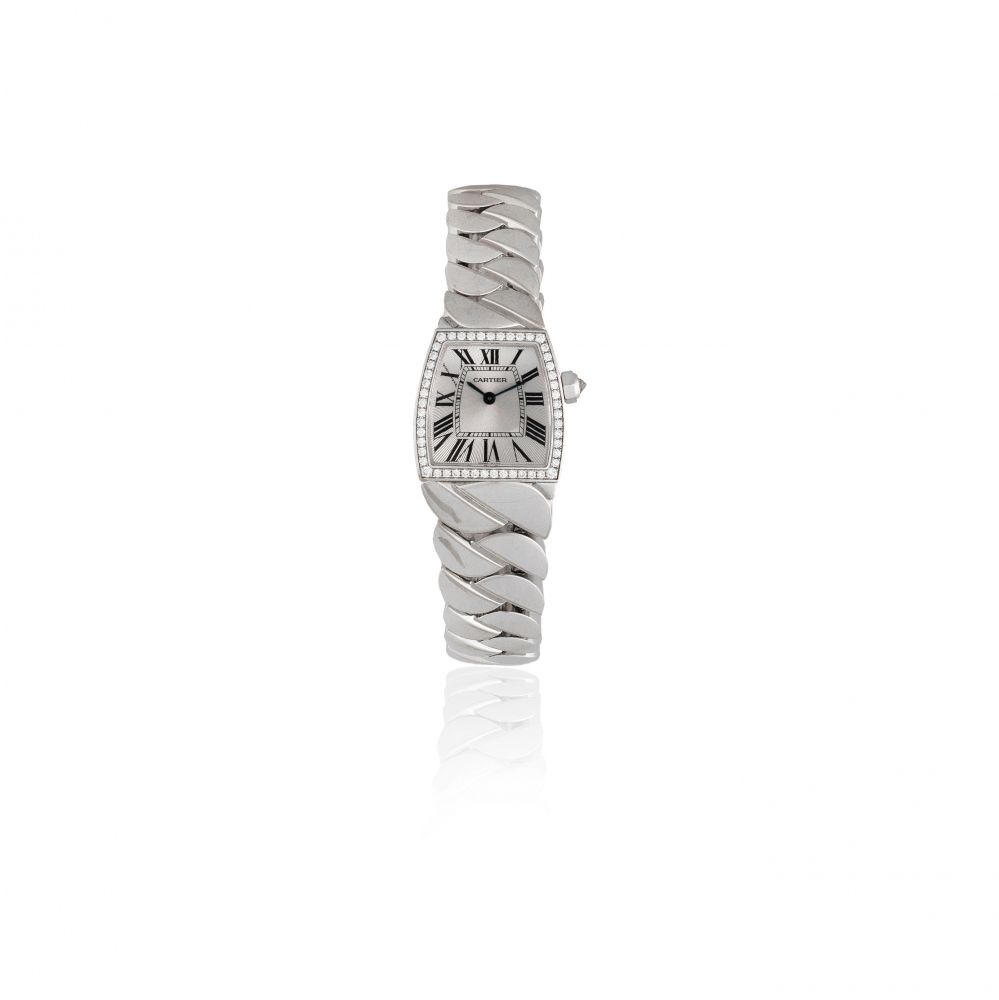 Cartier. A lady's 18K white gold and diamond set quartz bracelet watch