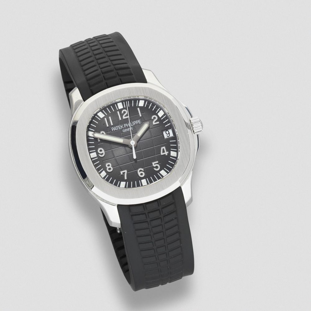 Patek Philippe. A stainless steel automatic calendar wristwatch