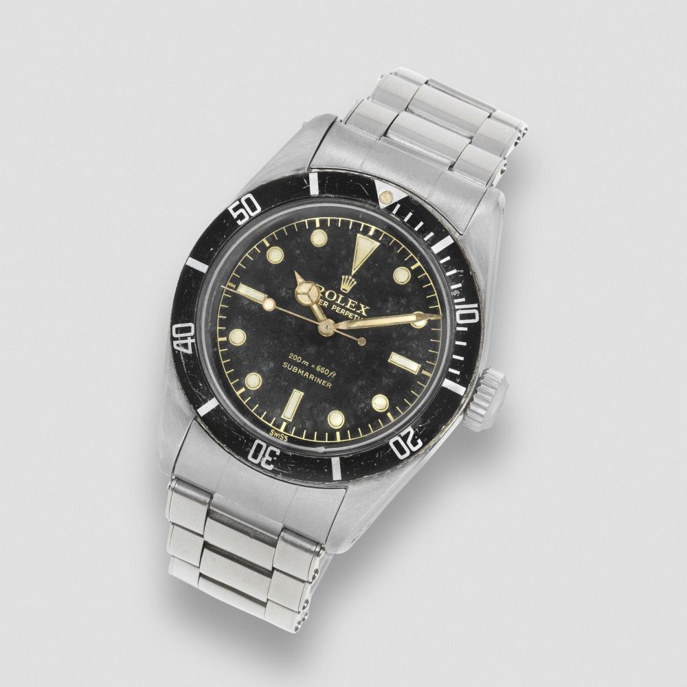 Rolex. A fine and rare stainless steel automatic bracelet watch with gilt dial and big crown