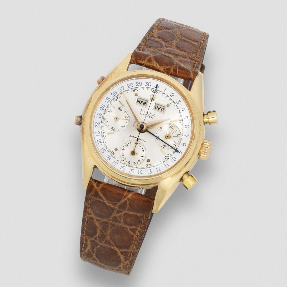 Rolex. A fine 18K rose gold manual wind triple calendar chronograph wristwatch
