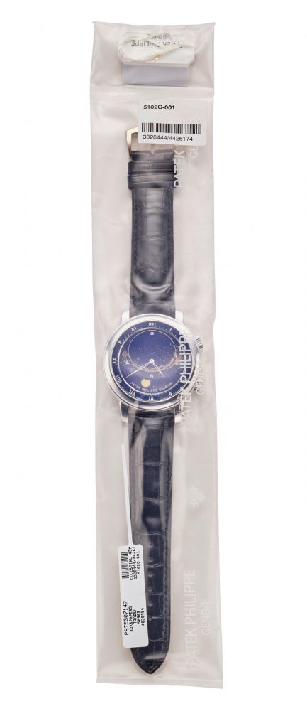 PATEK PHILIPPE. A VERY FINE AND RARE FACTORY SEALED 18K WHITE GOLD ASTRONOMICAL WRISTWATCH WITH SKY CHART, PHASES AND ORBIT OF THE MOON INCLUDING TIME OF MERIDIAN PASSAGE OF SIRIUS AND THE MOON