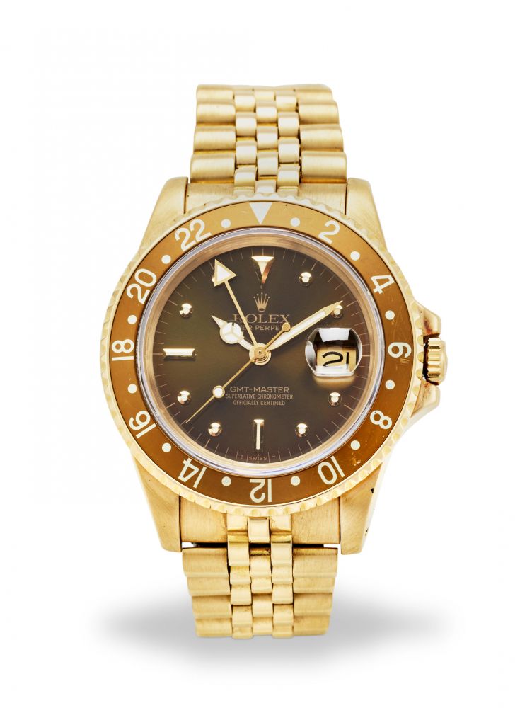ROLEX. AN 18K YELLOW GOLD AUTOMATIC CALENDAR BRACELET WATCH WITH DUAL TIME ZONE