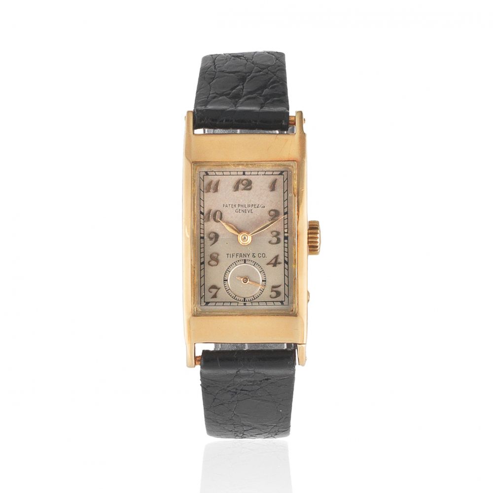 Patek, Philippe Co, Geneve. A rare double signed 18K gold manual wind rectangular wristwatch retailed by Tiffany Co.