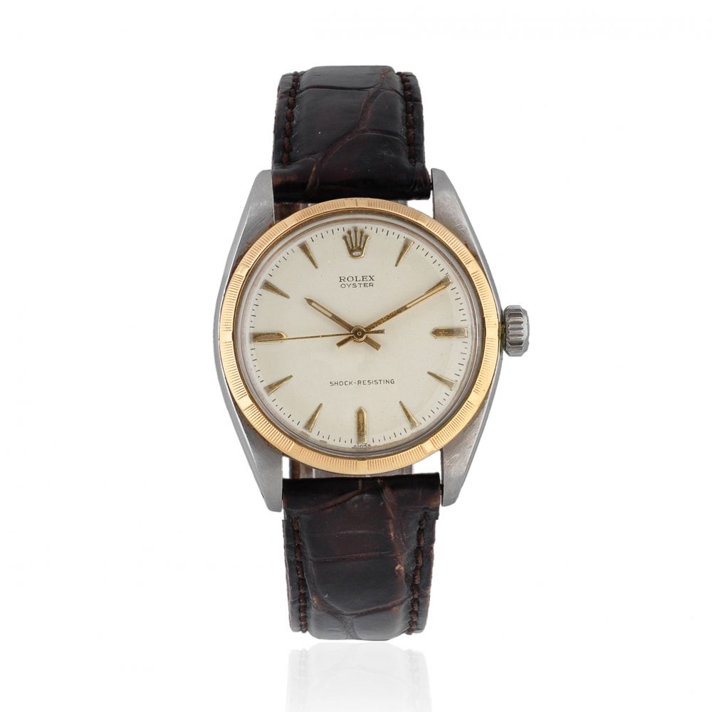 Rolex. A stainless steel and gold manual wind wristwatch