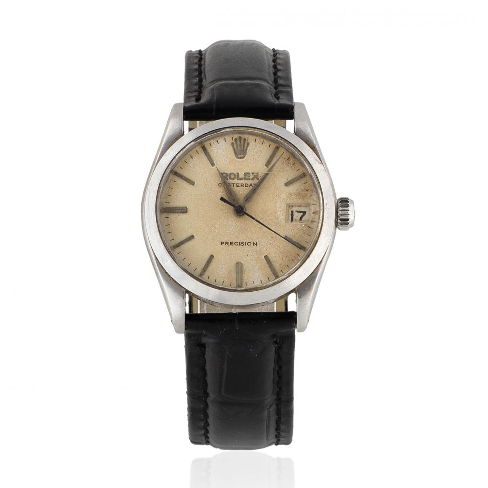 Rolex. A mid-size stainless steel manual wind calendar wristwatch