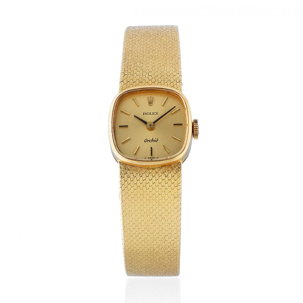 Rolex. A lady's 18K gold manual wind cushion form bracelet watch