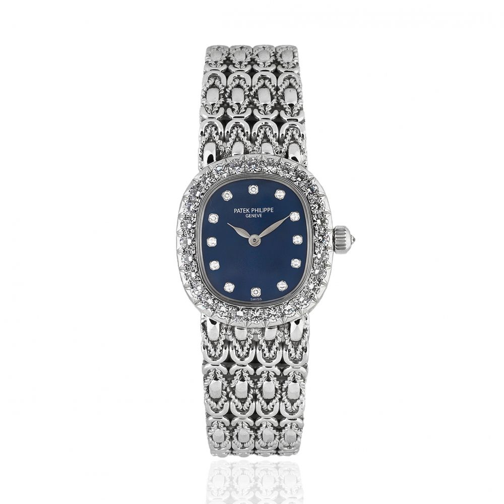 Patek Philippe. A lady's fine 18K white gold and diamond set manual wind bracelet watch
